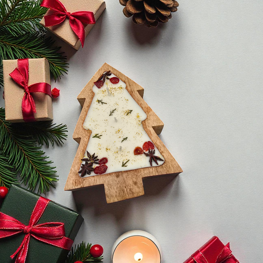 Wooden Christmas tree decoration with pine cones, berries, and a candle on a light gray background.