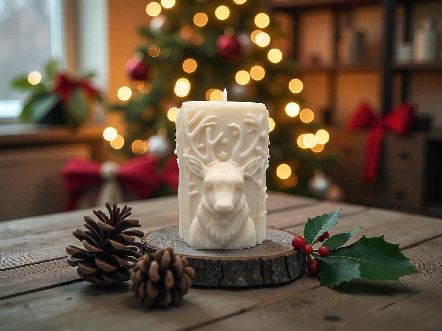 Decorative candle with a wolf design on a wooden surface with Christmas decorations in the background.